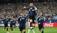 Argentina's forward #10 Lionel Messi celebrates scoring his team's third goal. (Photo by Paul Ellis / AFP)
