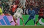 Austria's forward #14 Sasa Kalajdzic heads the ball to score his team's third goal. (Photo by Juan Mabromata / AFP)