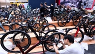 An employee prepares a booth at the EUROBIKE 2026 fair of the international bicycle industry in Frankfurt am Main, western Germany on June 23, 2026. (Photo by Kirill Kudryavtsev / AFP)