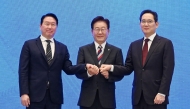 Republic of Korea President Lee Jae Myung (C), Samsung Electronics Chairman Lee Jae-yong (R) and SK Group Chairman Chey Tae-won (L) after a briefing announcement of public-private collaboration projects at the presidential Blue House in Seoul on June 29, 2026. (Photo by Kim Min-Hee / Pool / AFP)