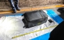 In this handout photo taken in Pattaya on June 27, 2026 and provided by Pattaya City Police Station on June 29, police officers measure a suitcase after the suspected murder of a 17-year-old Thai girl. (Photo by Handout / Pattaya City Police Station / AFP)