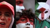 Combination photo showing fans of Morocco (L), Egypt (C) and Algeria (R) at the FIFA World Cup. AFP.