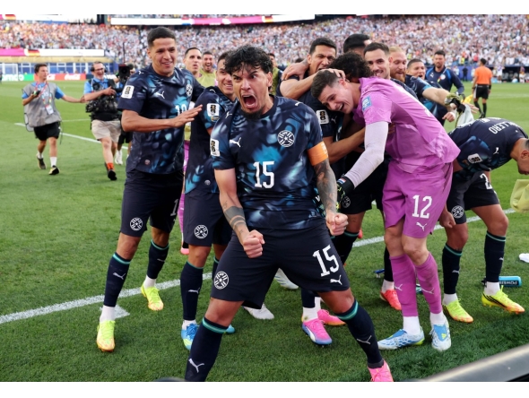 Gustavo Gomez #15 of Paraguay celebrates with teammates after Jose Canale #13 scores the winning penalty in a penalty shootout during the FIFA World Cup 2026 Round Of 32 match between Germany and Paraguay at Boston Stadium on June 29, 2026 in Foxborough, Massachusetts. (Photo by ALEXANDER HASSENSTEIN / GETTY IMAGES NORTH AMERICA / Getty Images via AFP)