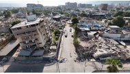 This aerial view shows a heavily damaged coastal area with collapsed buildings and debris following the June 24 twin earthquakes in Caraballeda, La Guaira State, Venezuela, on June 29, 2026. (Photo by Yorman Maldonado/ AFP)