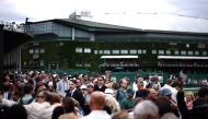 People await the start of the matches on the second day of the 2026 Wimbledon Championships at The All England Lawn Tennis and Croquet Club in Wimbledon, southwest London, on June 30, 2026. (Photo by Henry Nicholls / AFP) 