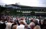 People await the start of the matches on the second day of the 2026 Wimbledon Championships at The All England Lawn Tennis and Croquet Club in Wimbledon, southwest London, on June 30, 2026. (Photo by Henry Nicholls / AFP) 