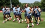 England's Harry Kane and teammates warm up during a training session. (AFP)