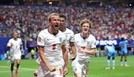 Harry Kane #9 of England celebrates with teammates Jude Bellingham #10 and Anthony Gordon #18 after scoring his team's first goal during the FIFA World Cup 2026 Round Of 32 match between England and Congo DR at Atlanta Stadium on July 01, 2026 in Atlanta, Georgia. (Photo by Richard Pelham / GETTY IMAGES NORTH AMERICA / Getty Images via AFP)