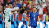 Croatia's midfielder #10 Luka Modric reacts next to Portugal's forward #07 Cristiano Ronaldo on July 2, 2026. (Photo by Kamil Krzaczynski / AFP)