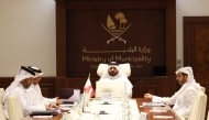 Undersecretary of the Ministry of Municipality H E Eng. Ali bin Mohammed Al Ali and other officials participating in the meeting.