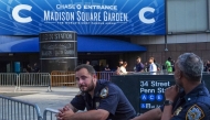 New York City police officers stand guard outside Madison Square Garden in Manhattan, New York on July 2, 2026. Photo by Ryan Murphy / AFP
