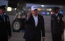US President Donald Trump gestures toward reporters after disembarking from Air Force One at Joint Base Andrews, Maryland on July 1, 2026. (Photo by Saul Loeb / AFP)