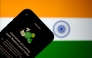 This illustration photograph taken on July 2, 2026, shows the new upcoming Usernamer feature on US instant messaging software WhatsApp, displayed on a smartphone with the backdrop of India's national flag in New Delhi. (Photo by Manan Vatsyayana / AFP)