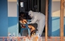 A healthcare worker takes samples from a patient suffering from Ebola virus disease at the Ebola Treatment Center of the Center Médical Évangélique (CME), in Bunia, Ituri, in the east of the Democratic Republic of Congo on June 23, 2026. (Photo by Benediction MURHABAZI / AFP)