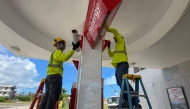 Workers secure a gas station ahead of the arrival of the forecasted Super Typhoon Bavi in Saipan, Northern Mariana Islands, on July 3, 2026. (Photo by Mark Rabago / AFP)