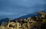 Rescuers work on the rubble of a collapsed building in Caraballeda, La Guaira state, Venezuela, on July 3, 2026.  (Photo by MARTIN BERNETTI / AFP)
 