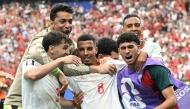 Morocco's midfielder #08 Azzedine Ounahi celebrates scoring his team's second goal with teammates during the 2026 World Cup round of 16 football match between Canada and Morocco at the Houston Stadium in Houston on July 4, 2026. (Photo by RONALDO SCHEMIDT / AFP)