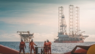Anchor handling activity during rig move operation at oil field.