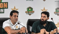 Pakistan national cricket selection committee members Aaqib Javed (L) and Misbah-ul-Haq address a press conference in Lahore on July 5, 2026.  (Photo by Arif ALI / AFP)
