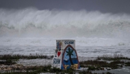 High waves crash against the coastline at a beach as the forecasted Super Typhoon Bavi approaches in Guam on July 5, 2026.(Photo by Yuichi YAMAZAKI / AFP)