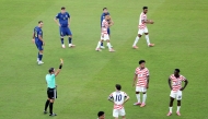 Referee Raphael Claus shows Folarin Balogun #20 of the United States a red card for a foul on Tarik Muharemovic #4 of Bosnia and Herzegovina during the FIFA World Cup 2026 Round of 32 match between USA and Bosnia and Herzegovina at San Francisco Bay Area Stadium on July 01, 2026 in Santa Clara, California. (Photo by MICHAEL STEELE / GETTY IMAGES NORTH AMERICA / Getty Images via AFP)

