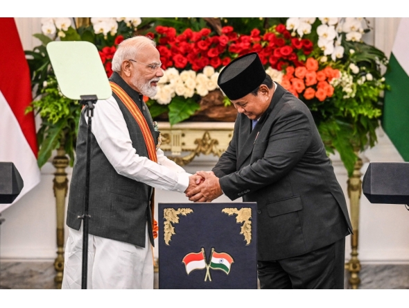 India's Prime Minister Narendra Modi (L) and Indonesia's President Prabowo Subianto shake hands after attending a joint press conference at the Merdeka Palace in Jakarta on July 7, 2026. (Photo by AFP)