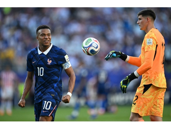 France's forward #10 Kylian Mbappe celebrates past Paraguay's goalkeeper #12 Orlando Gill after winning the 2026 World Cup round of 16 football match between Paraguay and France at the Philadelphia Stadium in Philadelphia on July 4, 2026. (Photo by MAURO PIMENTEL / AFP)