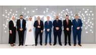 Chief Executive Officer, Qatar, HSBC Bank Middle East Limited, Abdul Hakeem Mostafawi and Chief Executive Officer, Noqoody, Nayef Rashwan pose for a group photo with other officials.