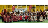 Executive Director of Women’s and Girls’ Sports at Qatar Foundation Alanoud Al Mesnad and President of the Qatar Volleyball Association Ali Ghanim Al-Kuwari pose with winners across all categories.