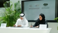President of Pre-University Education at Qatar Foundation Abeer Al Khalifa and President of QCTF Eng Abdulaziz Saud Al Tamimi signing the agreement during the ceremony.