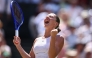 Ukraine's Marta Kostyuk celebrates winning against Italy's Jasmine Paolini during their women's singles quarter-final tennis match on the tenth day of the 2026 Wimbledon Championships at The All England Lawn Tennis and Croquet Club in Wimbledon, southwest London, on July 8, 2026. (Photo by Henry Nicholls / AFP)