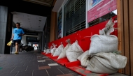 Sandbags are stacked outside a building ahead of the arrival of Typhoon Bavi in Keelung on July 10, 2026 (Photo by I-Hwa Cheng / AFP)
 