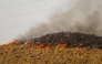 Flames stretching along a hillside are pictured in the area of a wildfire that killed at least 12 people near Bedar, in Los Gallardos district, in Almeria Province, on July 11, 2026.  (Photo by JORGE GUERRERO / AFP)