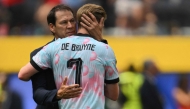 Belgium’s head coach Rudi Garcia and midfielder Kevin De Bruyne hug after the match. PICS: AFP