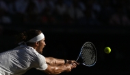  Germany's Alexander Zverev returns to Italy's Jannik Sinner during their men's singles final tennis match on the fourteenth day of the 2026 Wimbledon Championships at The All England Lawn Tennis and Croquet Club in Wimbledon, southwest London, (Photo by Kirill KUDRYAVTSEV / AFP) 