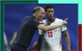 England coach Thomas Tuchel speaks with Jude Bellingham during the semi-final against Argentina. 