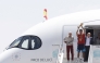 Spain’s coach Luis de la Fuente (left) and captain Rodri hold the World Cup trophy upon their arrival in Madrid Barajas’ airport. 