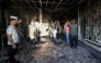 Palestinians watch as a fire blazes near the village of Tell, west of Nablus in the occupied West Bank on July 18, 2026, after a reported arson attack by Israeli settlers on the village, according to eyewitnesses. Photo by JAAFAR ASHTIYEH / AFP