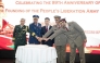 Chinese Ambassador to Qatar H E Cao Xiaolin (centre) and other officials during a cake-cutting ceremony at the reception.