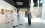 Officials and visitors at the exhibition.