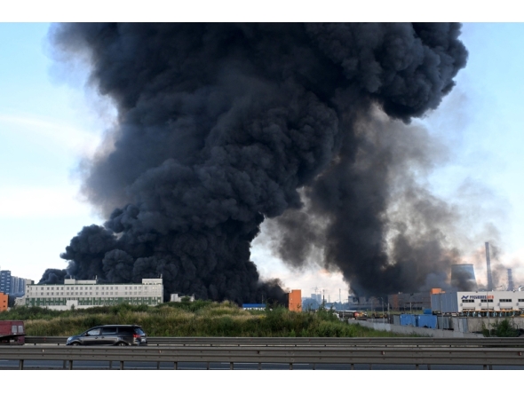 Smoke rises above a warehouse in Saint Petersburg on July 24, 2026, amid the ongoing Russian-Ukrainian conflict. (Photo by AFP)
