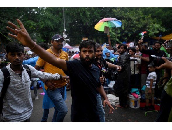 Cockroach Janta Party (CJP) founder Abhijeet Dipke speaks to the media at Jantar Mantar in New Delhi on July 24, 2026 during the ongoing protest to demand the resignation of India's Education Minister Dharmendra Pradhan over alleged NEET exam irregularities. (Photo by Arun SANKAR / AFP)