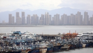 Fishing boats take shelter from the typhoon at a port in Xiamen, southeast China's Fujian Province, on July 25, 2026. (Photo by Zeng Demeng/Xinhua)