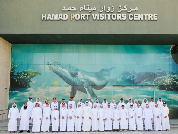 Officials and students at Hamad Port Visitors Centre. 