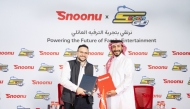 Snoonu and Spacetoon Go officials during the signing of the agreement. 