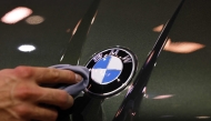 (Files) A staff member cleans the car logo of a BMW at the International Motor Show IAA on September 8, 2025, in Munich, southern Germany. (Photo by Alexandra Beier / AFP)
 