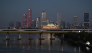 Buildings are seen behind a bridge over the Han River in Seoul on August 1, 2026. (Photo by Greg Baker / AFP)