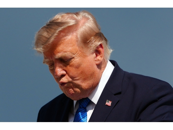 US President Donald Trump gestures while stepping off Air Force One upon arrival at Morristown Municipal Airport in Morristown, New Jersey, on July 31, 2026. (Photo by Aaron Schwartz / AFP)
 