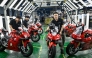 This picture taken on July 20, 2026 shows workers preparing to test assembled motorcycles at the ZXMOTO factory in Chongqing, southwestern China. (Photo by Wang Zhao / AFP) 