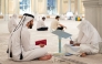 A participant with a teacher during a session of the Quran recitation programme.
